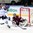MINSK, BELARUS - MAY 10: Latvia's Edgars Masalskis #31 stretches out in attempt to make the save on Finland's Petri Kontiola #27 during preliminary round action at the 2014 IIHF Ice Hockey World Championship. (Photo by Andre Ringuette/HHOF-IIHF Images)

